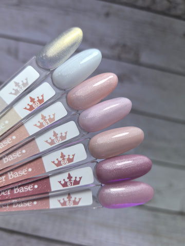 Assorted shades of Nude Rubber Base 60 on display, showcasing medium viscosity and pigmentation for nail applications.