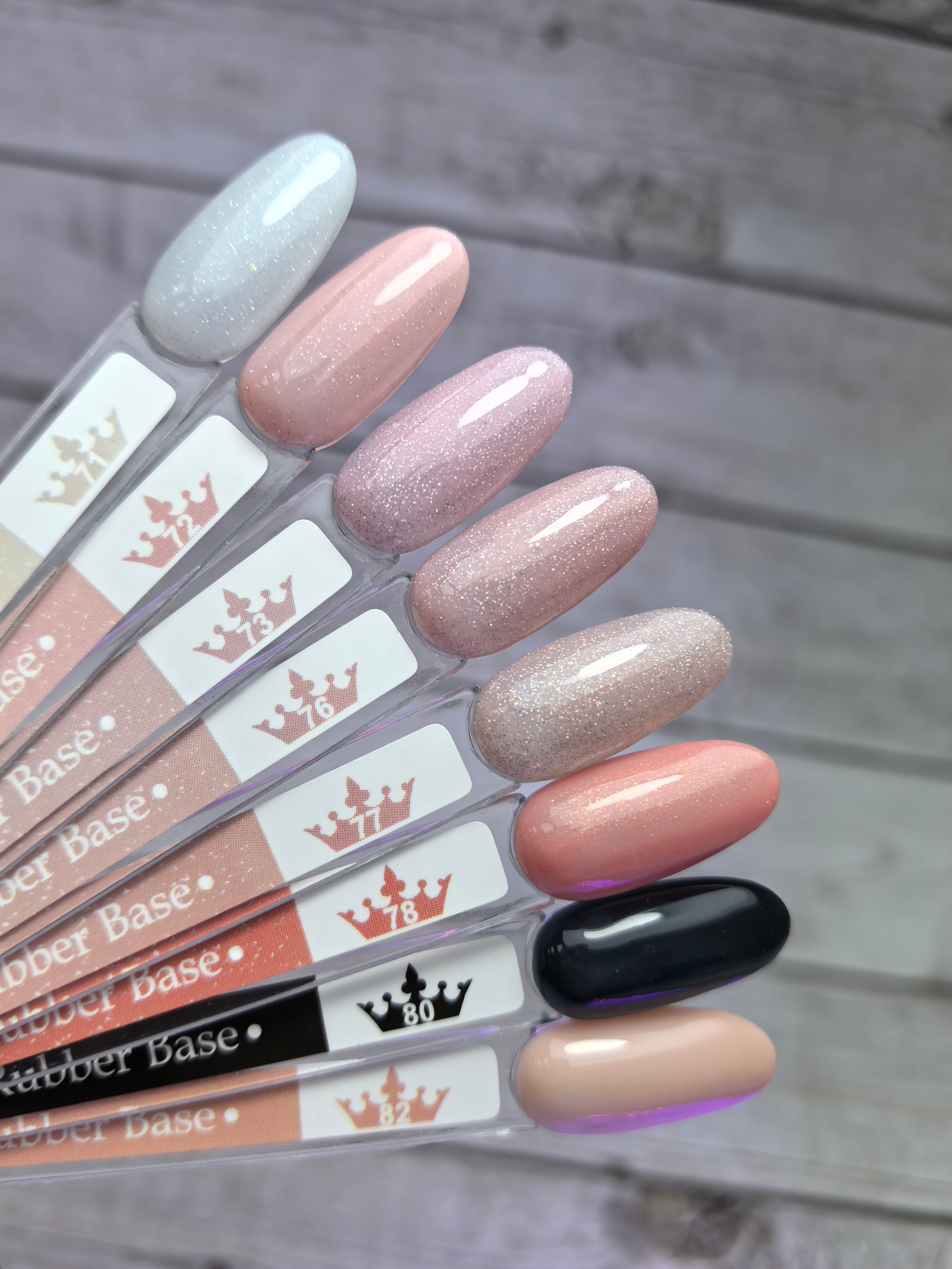 Nude Rubber Base 80 nail polish samples showcasing various shades on a neutral background